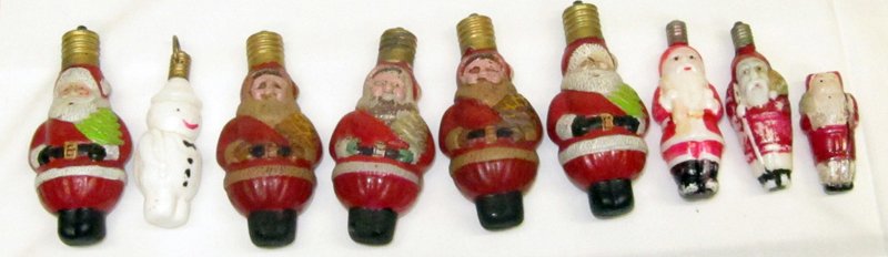 FIGURAL CHRISTMAS LIGHT BULBS (8): (7) Assorted Santas, (1) snowman; some have paint loss; H-3" - 3 1/2", G-VG