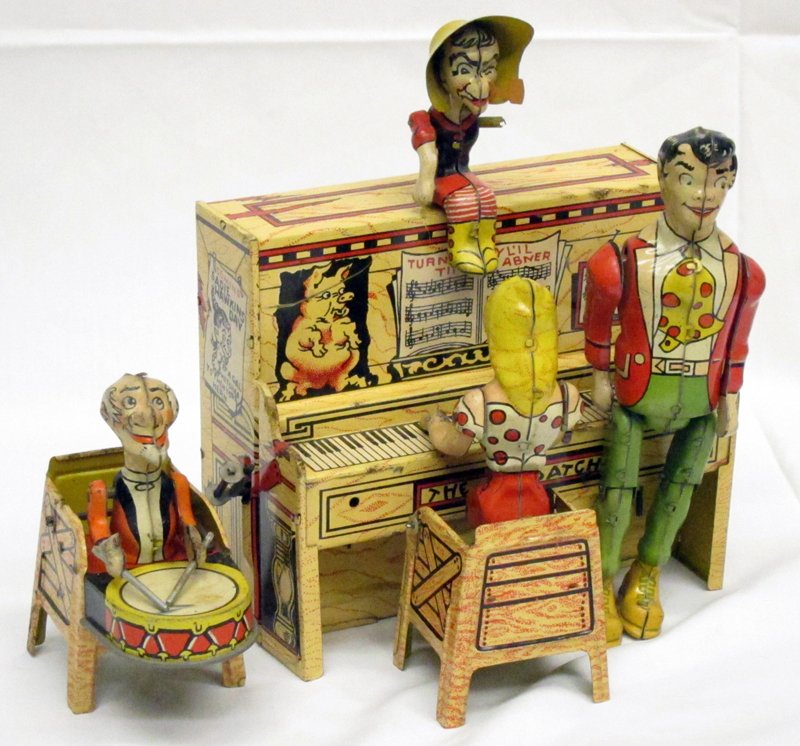 LIL ABNER DOGPATCH BAND: Unique Art Mfg. Co., copyright 1945; tin litho; wind-up, working, "USA"; scratches, scuffs and spotting; right arm missing on top figure; H-8", G