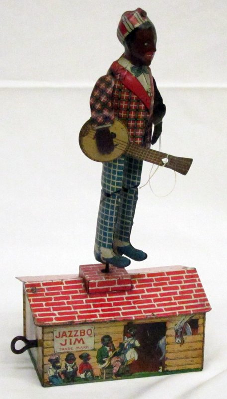 JAZZBO JIM WIND-UP TOY: Unique Art; tin litho; working; "USA"; banjo detached from left hand; scratches and scuffs; H-10", G