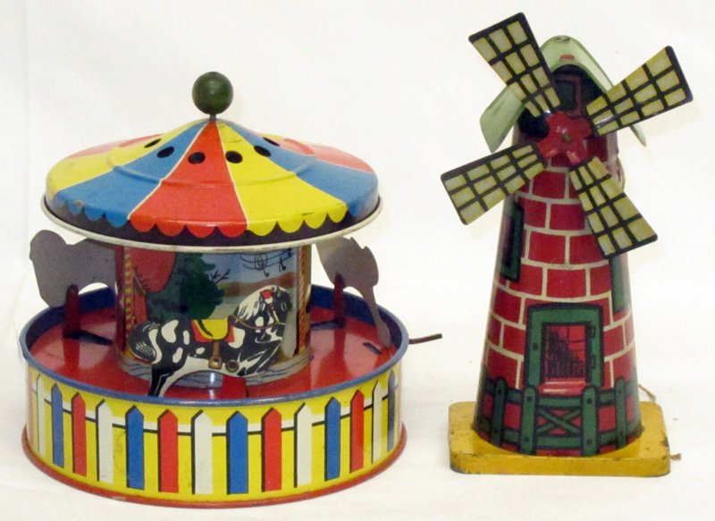 CAROUSEL and WINDMILL TOYS: Tin litho; working; (1) carousel horses: USA; plays music and turns when cranked; (1) windmill: Patent pending; fan spins when string is pulled; some scuffs, scrapes and scratches overall; spotting on
