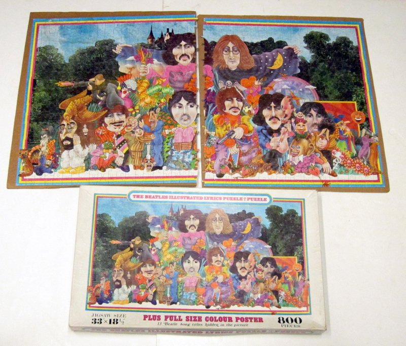 BEATLES ILLUSTRATED PUZZLE: "Beatles Illustrated Lyrics Puzzle in a Puzzle"; 800 pieces; in original box; with poster and instructions in an envelope inside the box; 18" x 34", EX