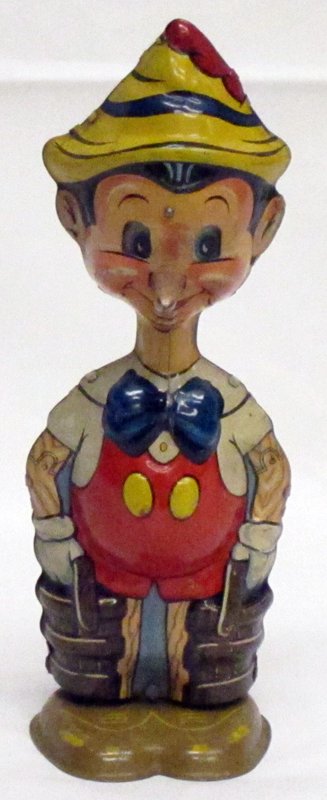 MARX PINOCCHIO WALKING PINOCCHIO TOY: Litho tin; mechanical; working; eyes move; minor wear and scratches; H-8 1/2", VG-EX