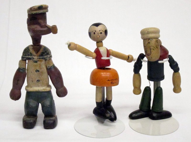 POPEYE & OLIVE OYL FIGURES (3): (2) Jaymar wood jointed figures, large Popeye and Olive Oyl ballerina with re-strung arms; (1) Folk Art Popeye - carved and painted wood, crazing; H-5"-7", G