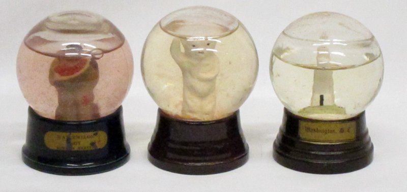 SOUVENIR SNOW GLOBES: Glass with porcelain bases; (1) polar bear, (1) watermelon boy; (1) Washington Monument; water discoloration; H-4", G-VG
