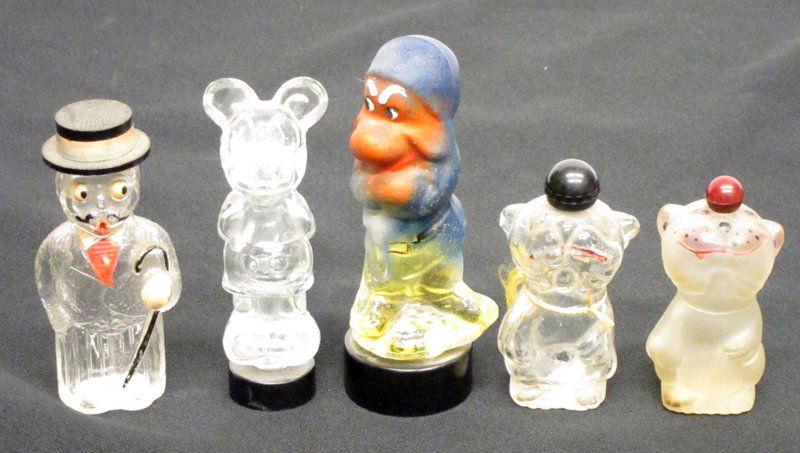 COMIC CHARACTER PERFUME BOTTLES (5): Glass; (2) Bonzo 1920's (1) tail broken; (1) Mickey Mouse; (1) Grumpy; (1) Dude with bowler hat; some missing paint; H-3"-4 1/2", G-VG