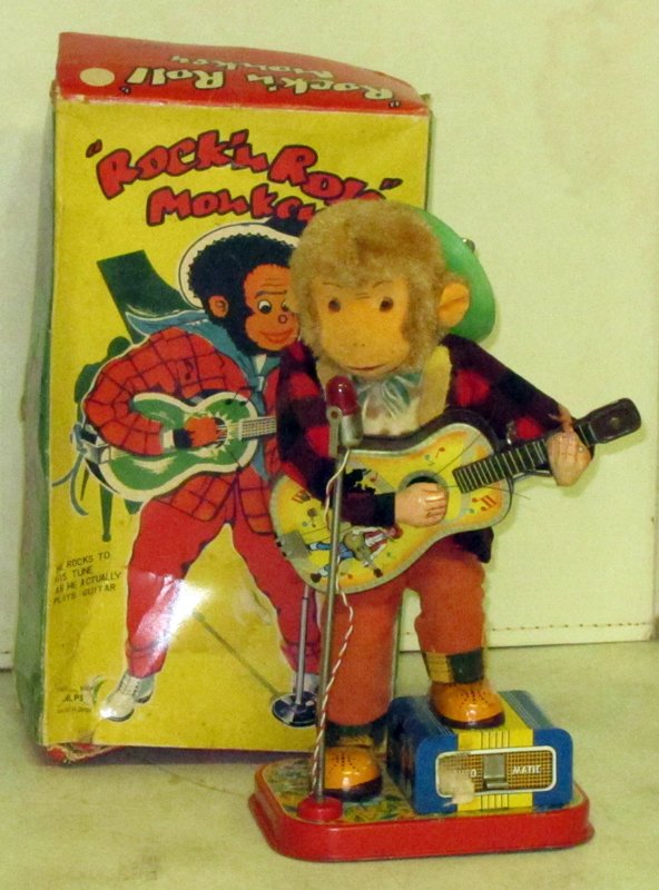 ROCK & ROLL MONKEY BATTERY OP: Alps, Japan; litho tin and cloth; runs but microphone does not light; original box punctured, torn and soiled, G-G+; needs new strings on guitar; clothes soiled; H-12", G-G+