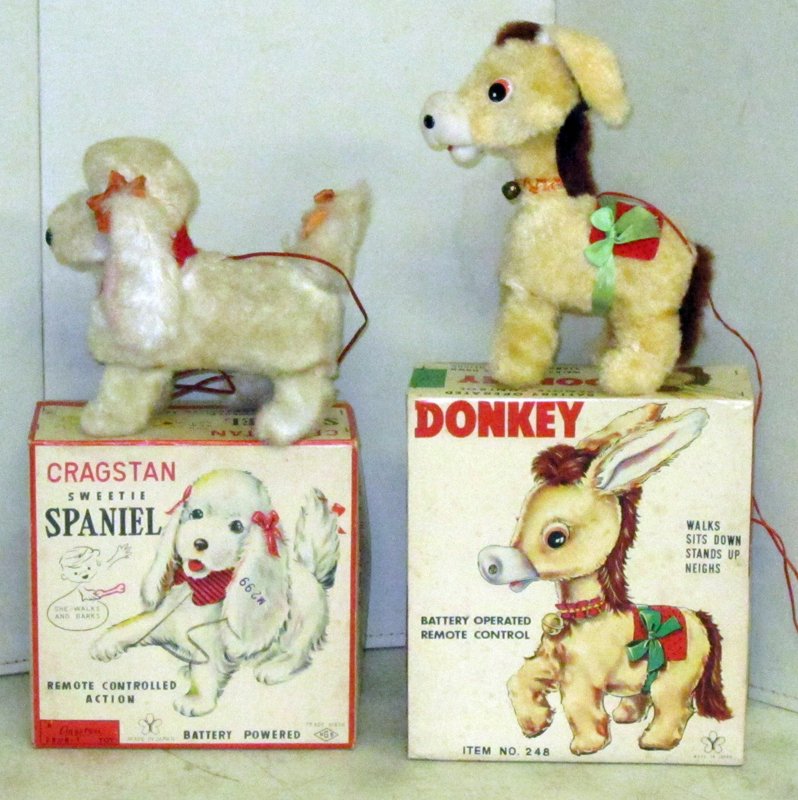 JAPAN BATTERY OP DONKEY & SPANIEL: Plush with original boxes; (1) Cragstan Spaniel: "Sweetie", runs, some soiling; (1) Donkey: Y, runs but sitting down-stand up motion not perfect, L-8", VG-EX