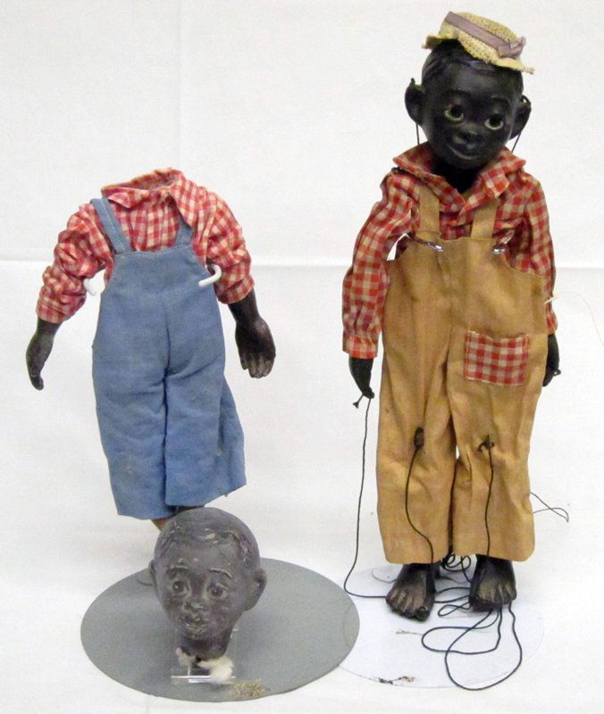 BLACK AMERICANA FIGURES (3): Composition heads; cloth dressed; (1) Effanbee marionette; (1) sharecropper figure with detached head; (1) folk art jigger with wood jointed body, undressed, head repainted; H-9"-12", F-VG