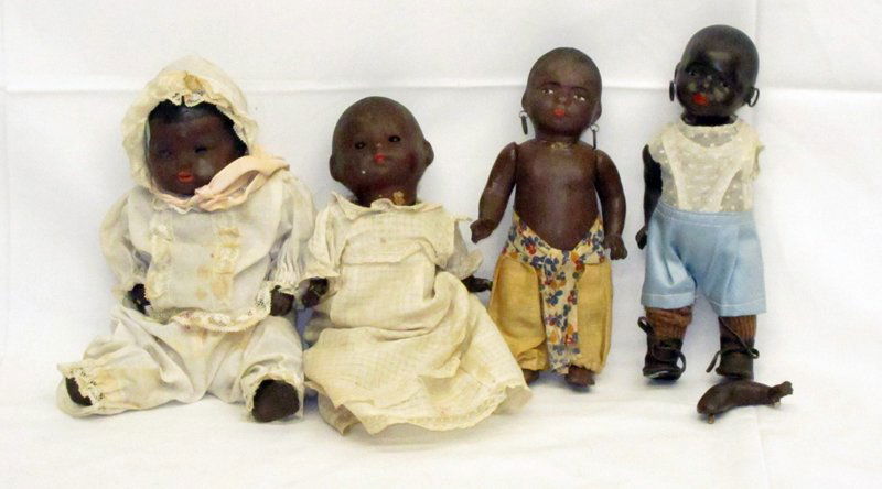 BLACK AMERICANA BABY DOLLS (4): Painted ceramic and composition heads; (1) A.M. Germany, missing eyes; (1) Huebach Kopplesdorf 399-17/0, glass eyes, needs arm re-strung; (2) others; H-9"-7", F-VG