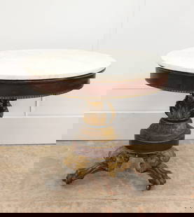 EMPIRE CENTER TABLE: Marble top round table; mahogany apron with black band; acanthus leaf foliate carved pedestal; black and gilt; carved gilt paw feet; normal wear; H-30 1/2", Dia.-34", G-G+
