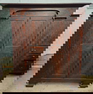 EMPIRE WARDROBE - THREE PIECE: Mahogany and figured mahogany veneer; two doors; column sides and scrolled feet; paneled ends are doors for storage; normal wear; H-88", L-80", Depth 24", G-VG