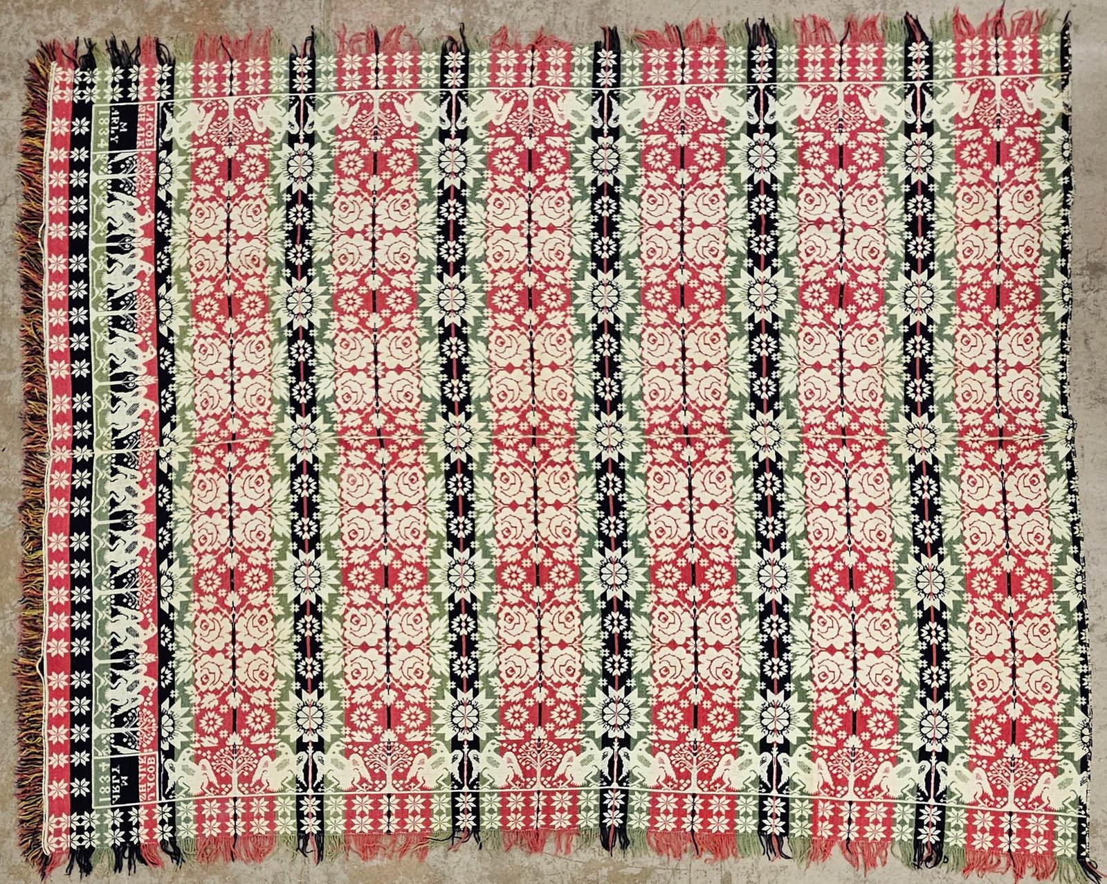 COVERLET: Birds, roses, flowers, stairs; red, green and blue; "Jacob Shalk - Marly 1834"; fringe separation; faded; 78" x 98", G
