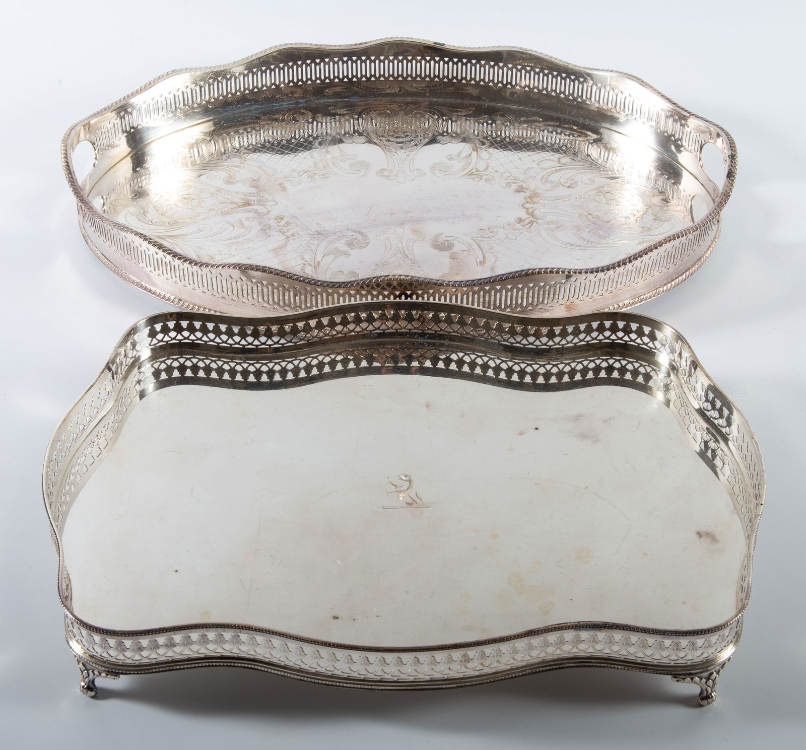 (2) ANTIQUE SILVER PLATES: Plated trays with galleries - (1) rectangular W.A. EPOC, L-13 1/2"; (1) oval William Adams w/foliate engraved handles, L-16", normal wear, vg-ex