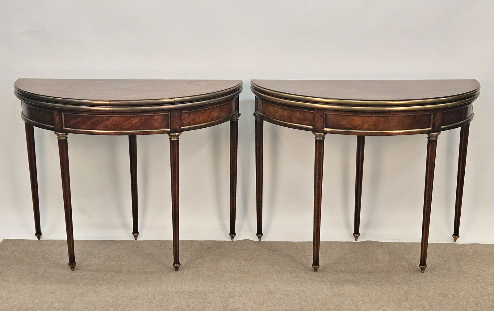 PAIR OF FLIP-TOP DEMI LUNE TABLES: Mahogany, opens to leather-top, round, H-31"x diameter-41", normal wear, VG