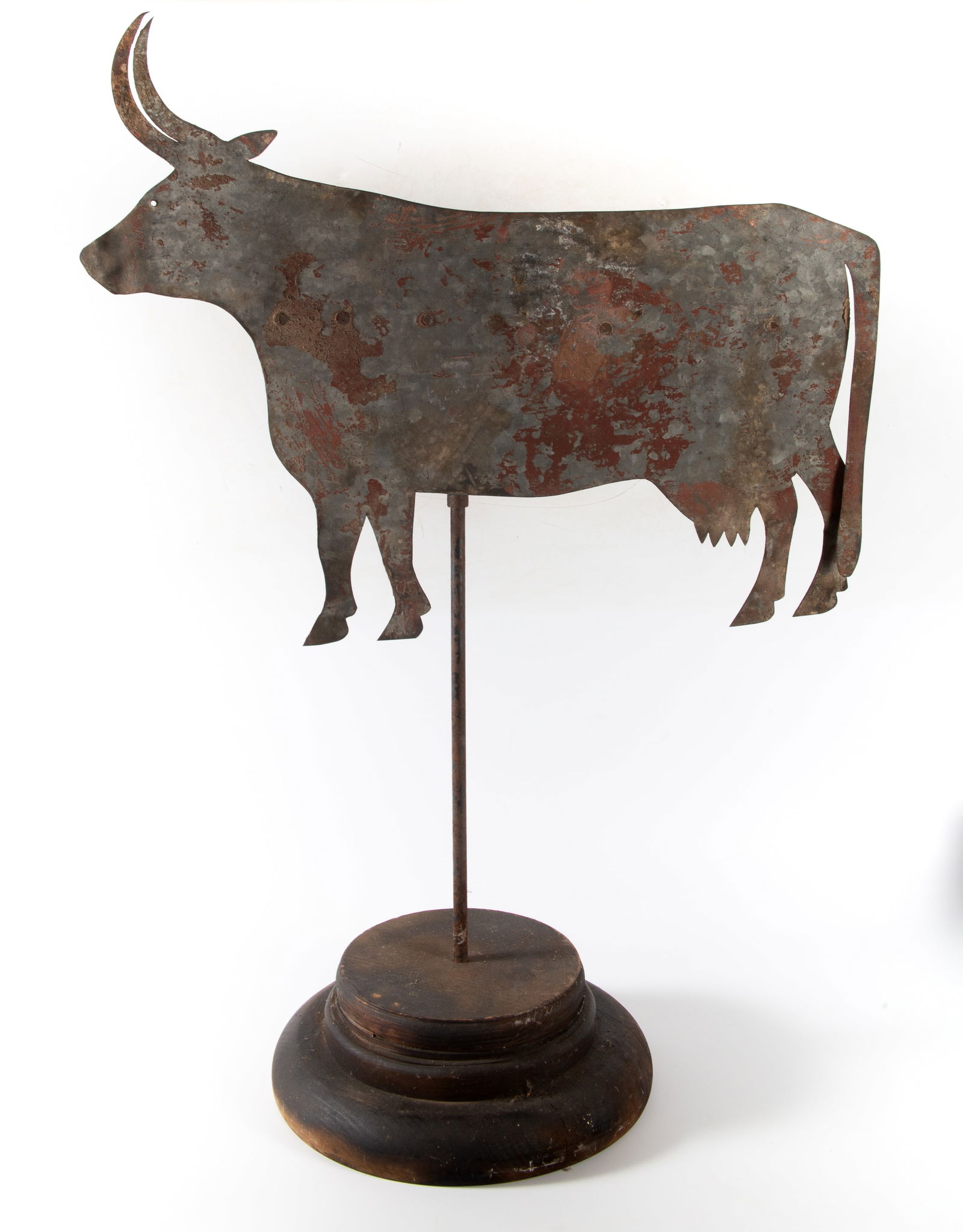 COW WEATHER VANE: Sheet metal cow, traces of red wrought iron backstraps, paint, together w/wood base, H-22"xL-27", normal wear, G-VG