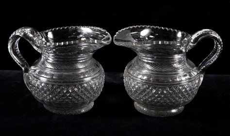 PAIR OF ANTIQUE CUT GLASS PITCHERS