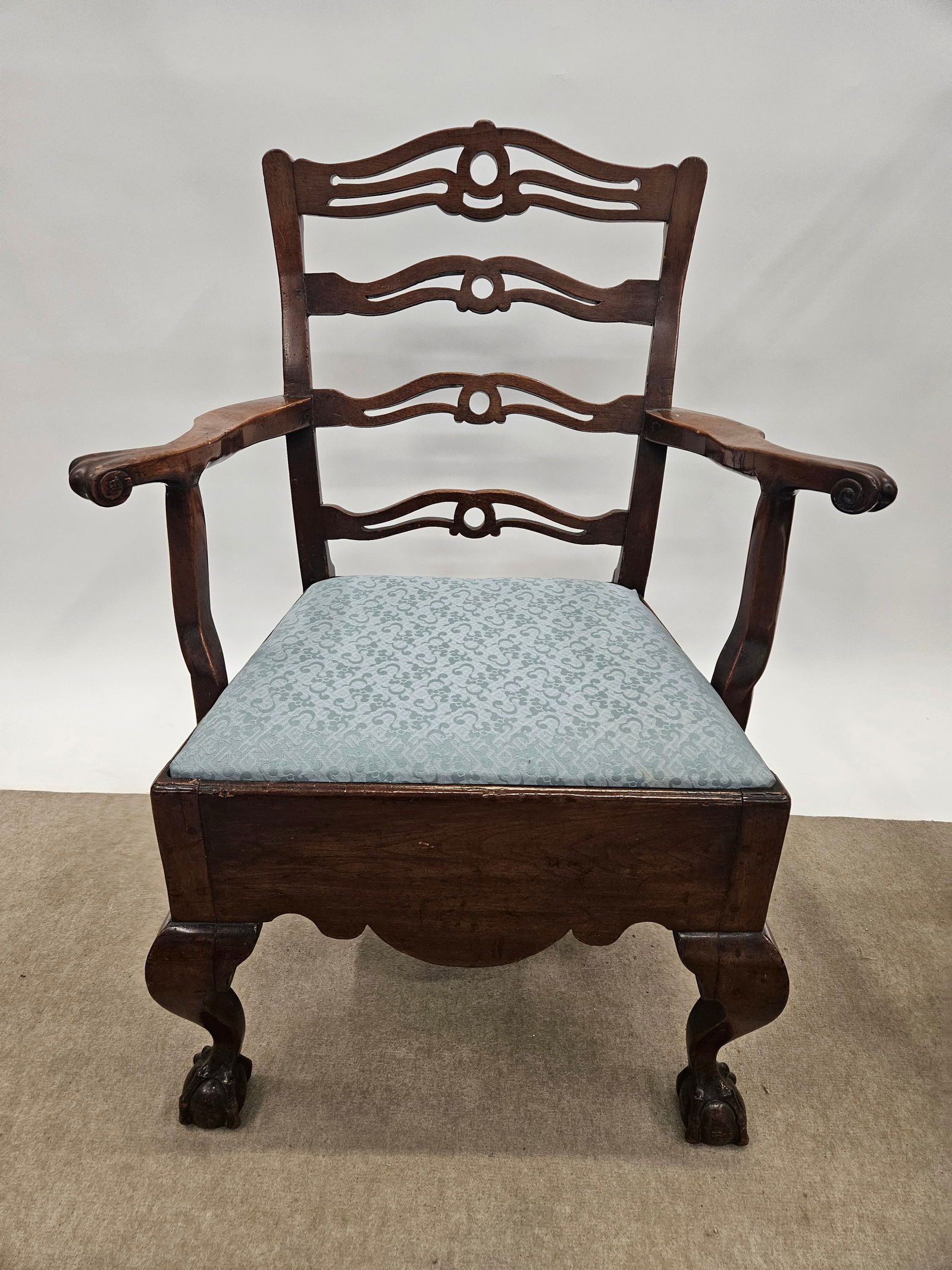 LANCASTER COUNTY COMMODE CHAIR: Walnut, ribbon back, deep scallop skirt, ball & claw front feet, H-40"xW-27", repair to right arm, missing commode. G
