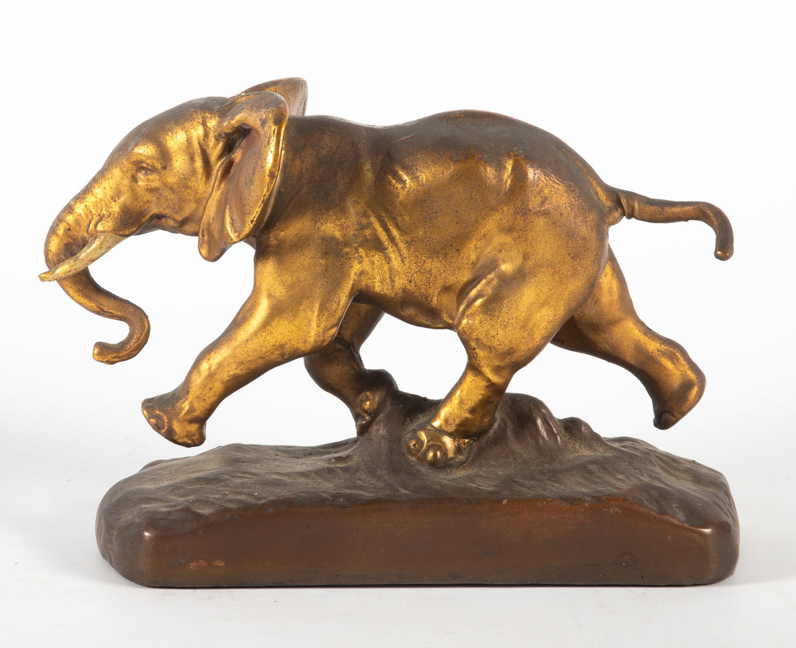 BARYE ELEPHANT FIGURE: Cased and filled metal figure of running elephant, Barye copy, H-6 1/2"xL-7 1/2", wear, F-G