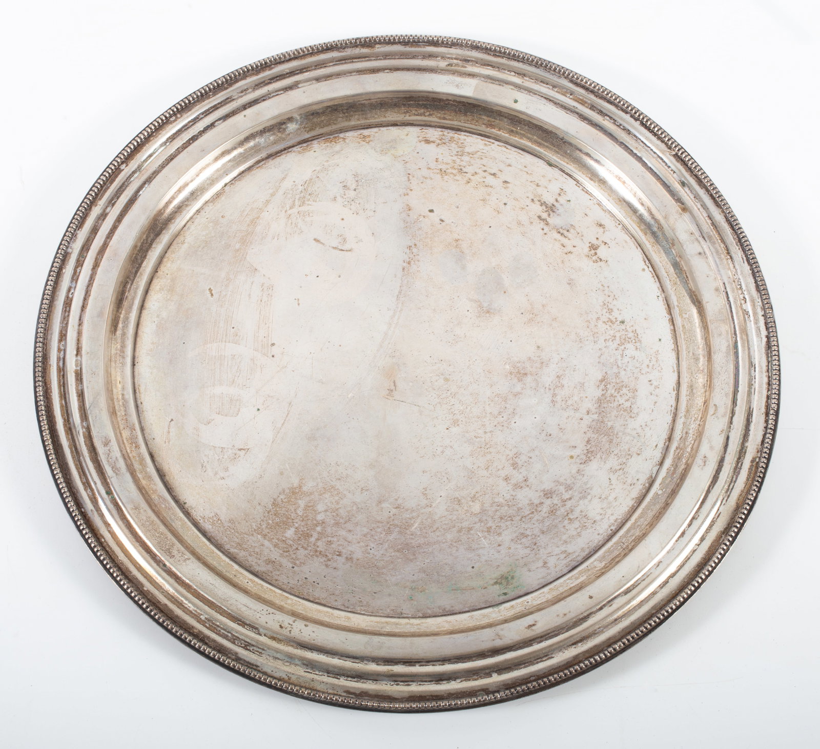 SILVER ROUND TRAY: Plain with beaded edge; touch marks under rim; normal wear; Dia.-15", [27 +/- ozt], G