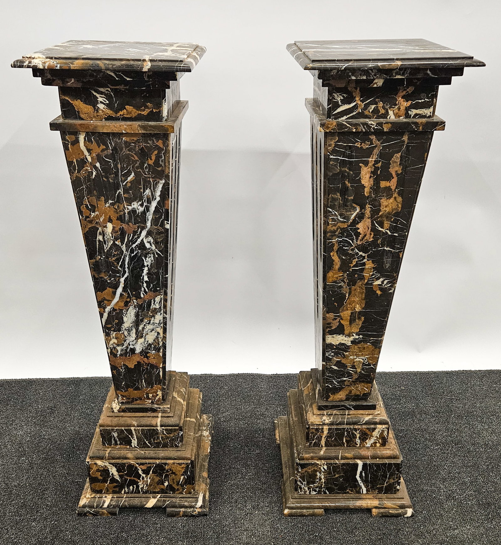 PAIR OF MARBLE PEDESTALS: Mottled brown and black marble; fluted tapered columns; H-42 1/2", 12 1/2" x 12 1/2", G-VG
