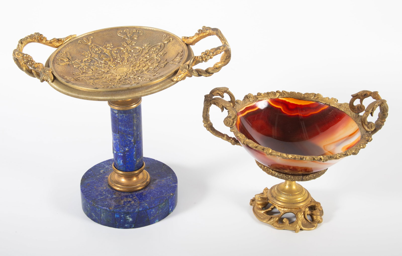 (2) HARDSTONE & ORMOLU TAZZAS: (1) with agate bowl, (1) with lapis (?) base and column, bent top; largest tazza 6 1/2", G