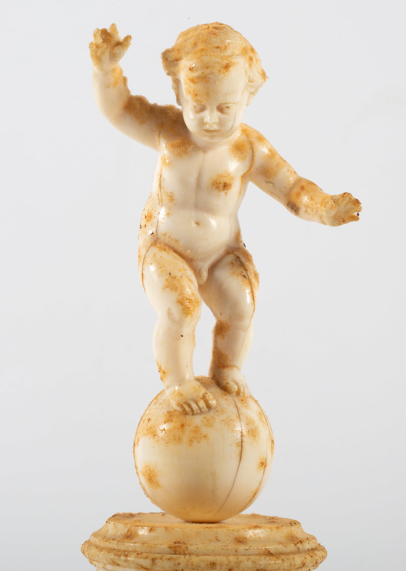 ANTIQUE CARVED BONE PUTTI - 2