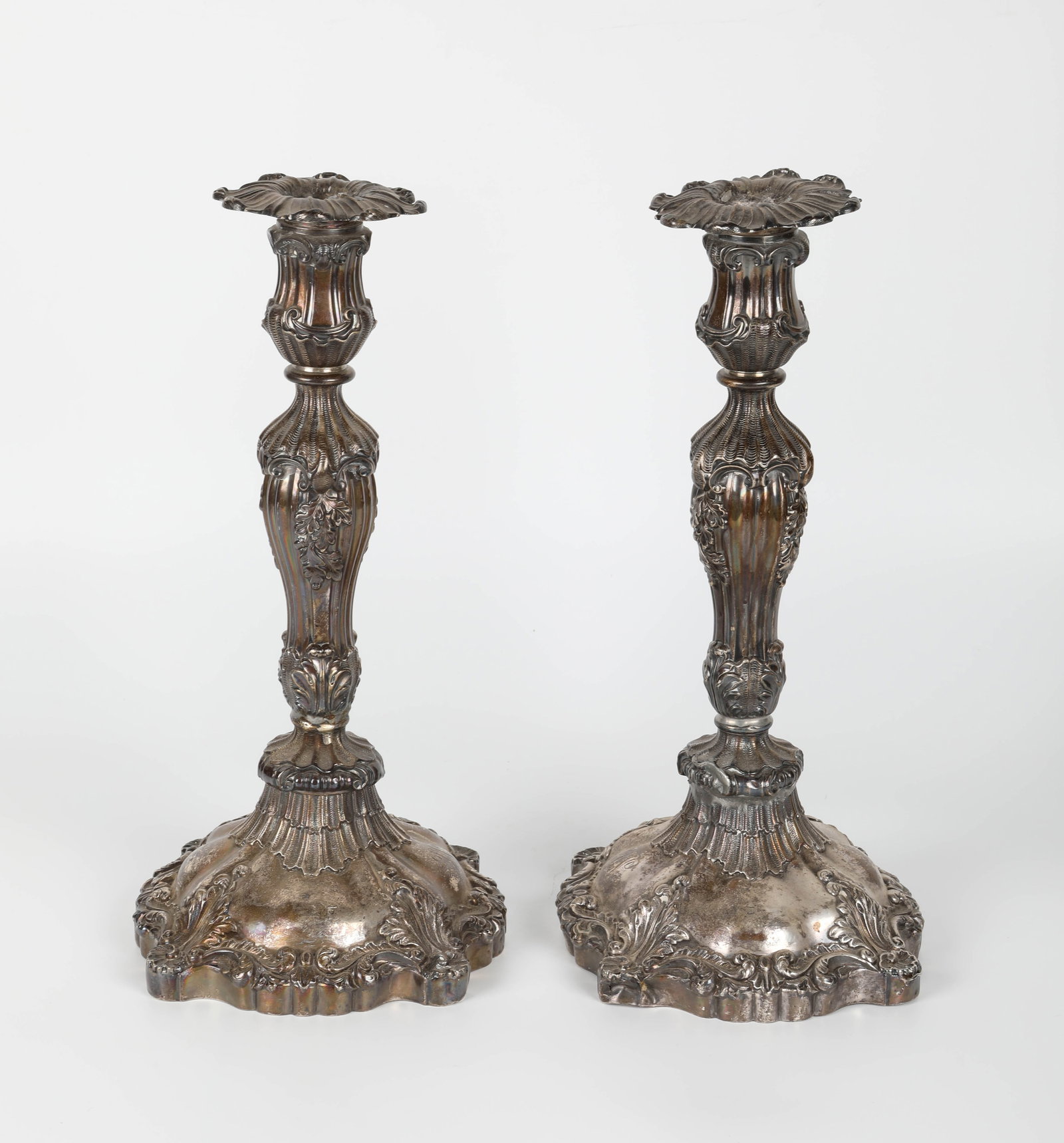 PAIR GEORGIAN SILVER CANDLESTICKS: Reinforced with solder at neck; base: Dia.-5 1/2", H-12", G