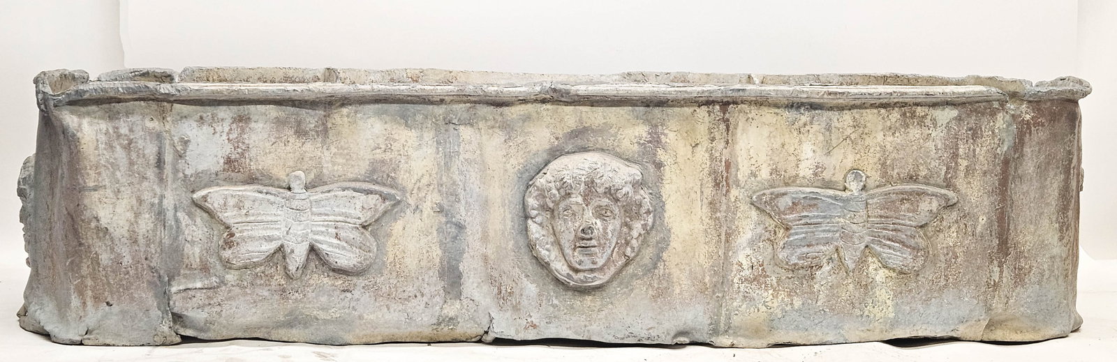 EARLY 18TH CENTURY LEAD CISTERN: Continental lead garden planter; various dents, bends, losses and separations; 47" x 14" x 11" high; F-G