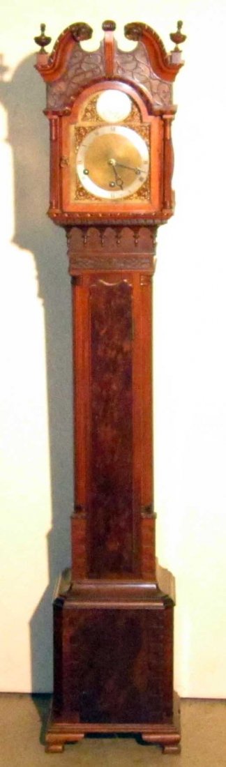 EDWARD GLASCOW GRANDMOTHER CLOCK: Mahogany ornately carved and decorated case; broken arch with floral rosettes and reeded bonnet columns; relief scroll carvings; Greek key style relief work; tear drops; reeded quarter columns; shaped