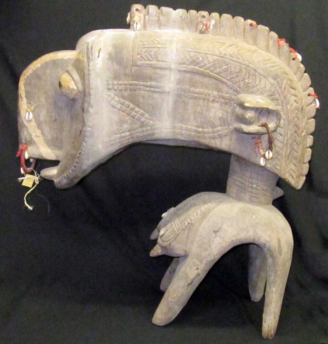 AFRICAN TRIBAL HEADDRESS: Baga Nimba shoulder headdress, carved painted wood with rope and cowrie shell adornments, H-31 1/2", L-29",