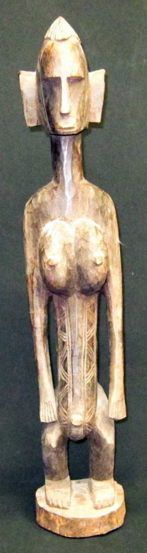 AFRICAN TRIBAL SCULPTURES (3): (1) Bamana (Mali) figure: female, carved wood, H-28"; (1) Baule (Ivory Coast) figure: female, carved wood, H-28 3/4"; (1) female figure: carved wood, some chips to hand, H-25"