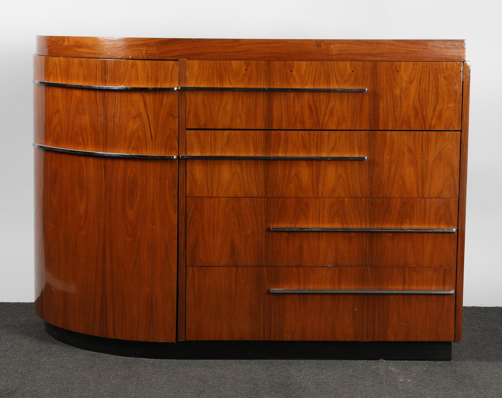 DONALD DESKY STYLE DESK: Walnut and chrome; (4) drawers, the top being a fall front desk drawer; curved side door; H-39"xW-53"; normal wear; fall front drawer needs work, G