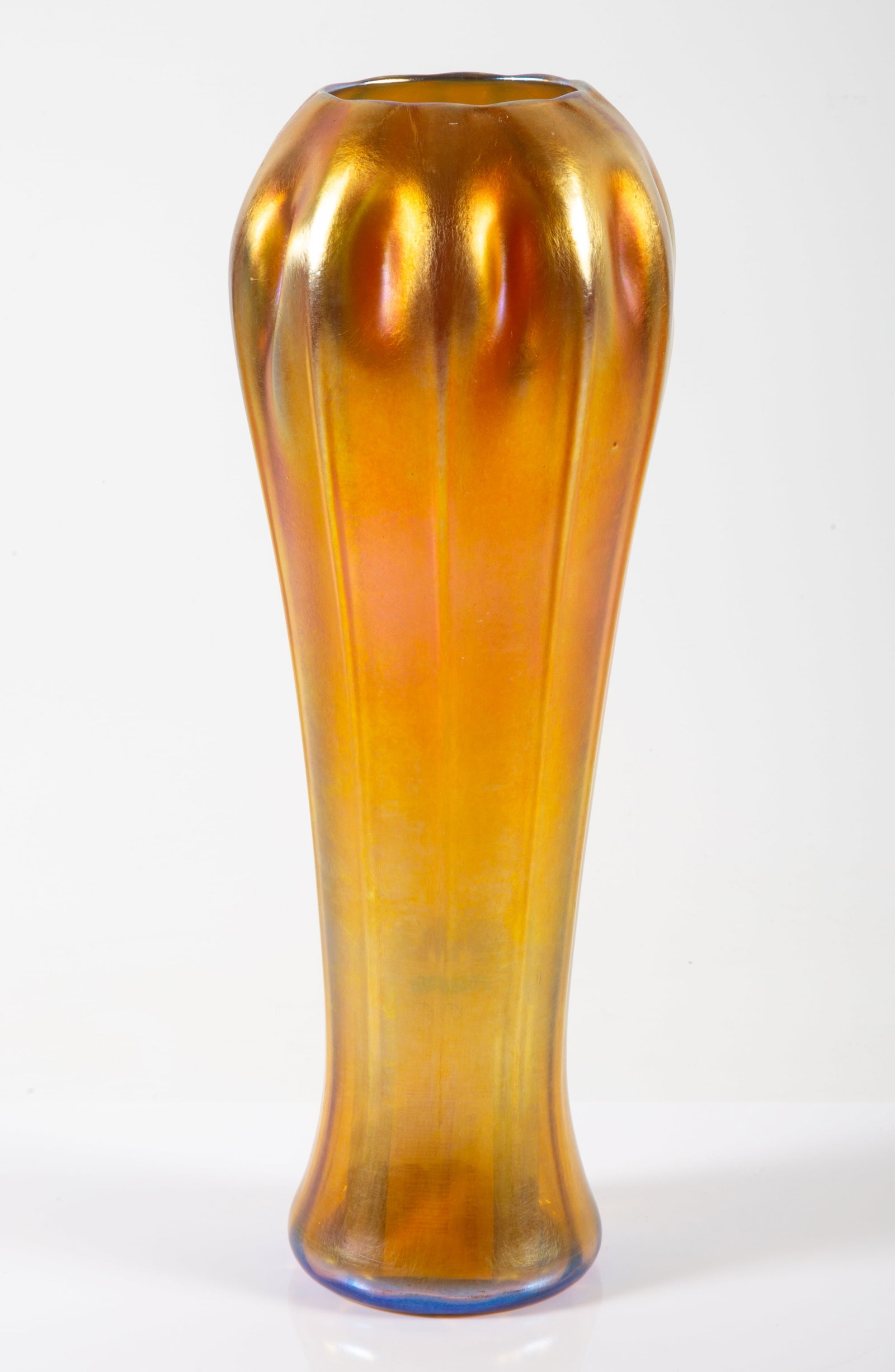 L.C. TIFFANY FAVRILE GLASS VASE: Signed; model 6506-H; metallic gold; iridescent finish with fluted form; H-12 1/2", VG-EX