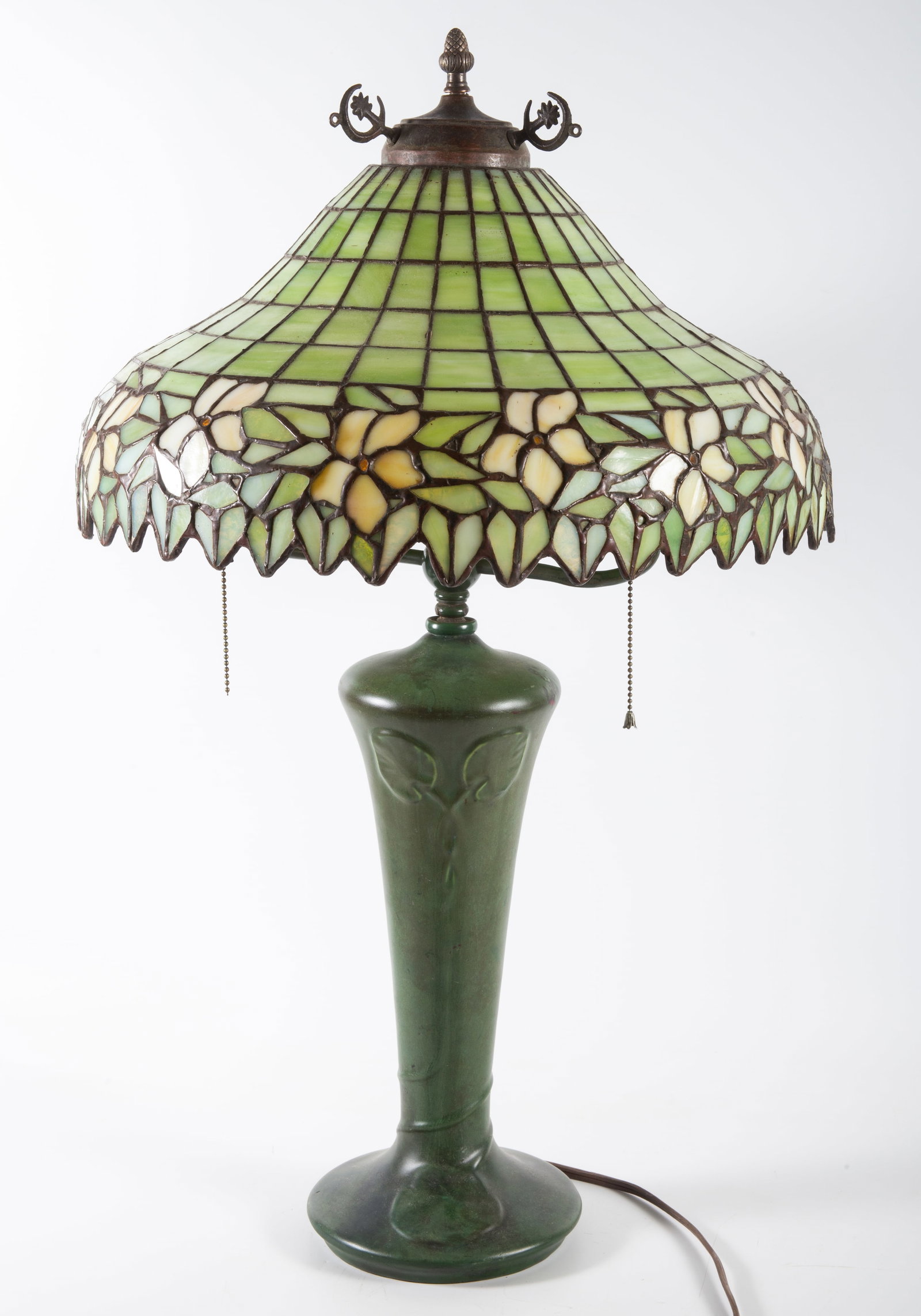 ART NOUVEAU TABLE LAMP: Hampshire pottery base; leaded glass shade with floral motif; lamp appears to be marriage; H +/-30"; normal wear, G-VG