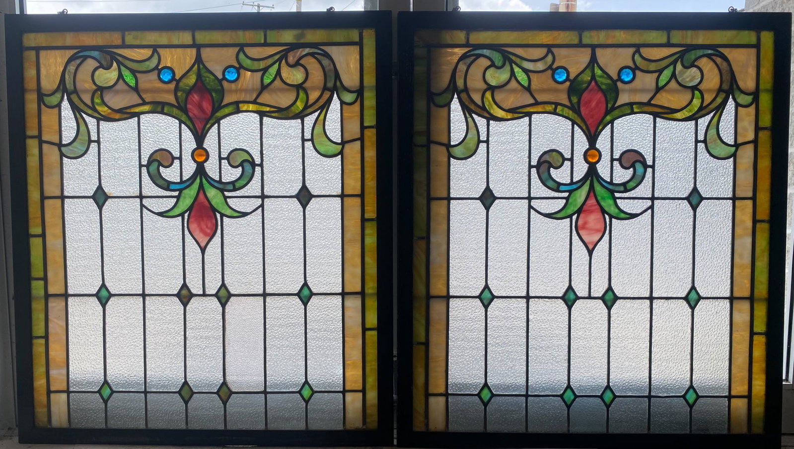 LEADED AND STAINED GLASS WINDOW: Fleur de Lis form; (2) pieces makes (1) window; jewels; 72"x32"; normal wear, G