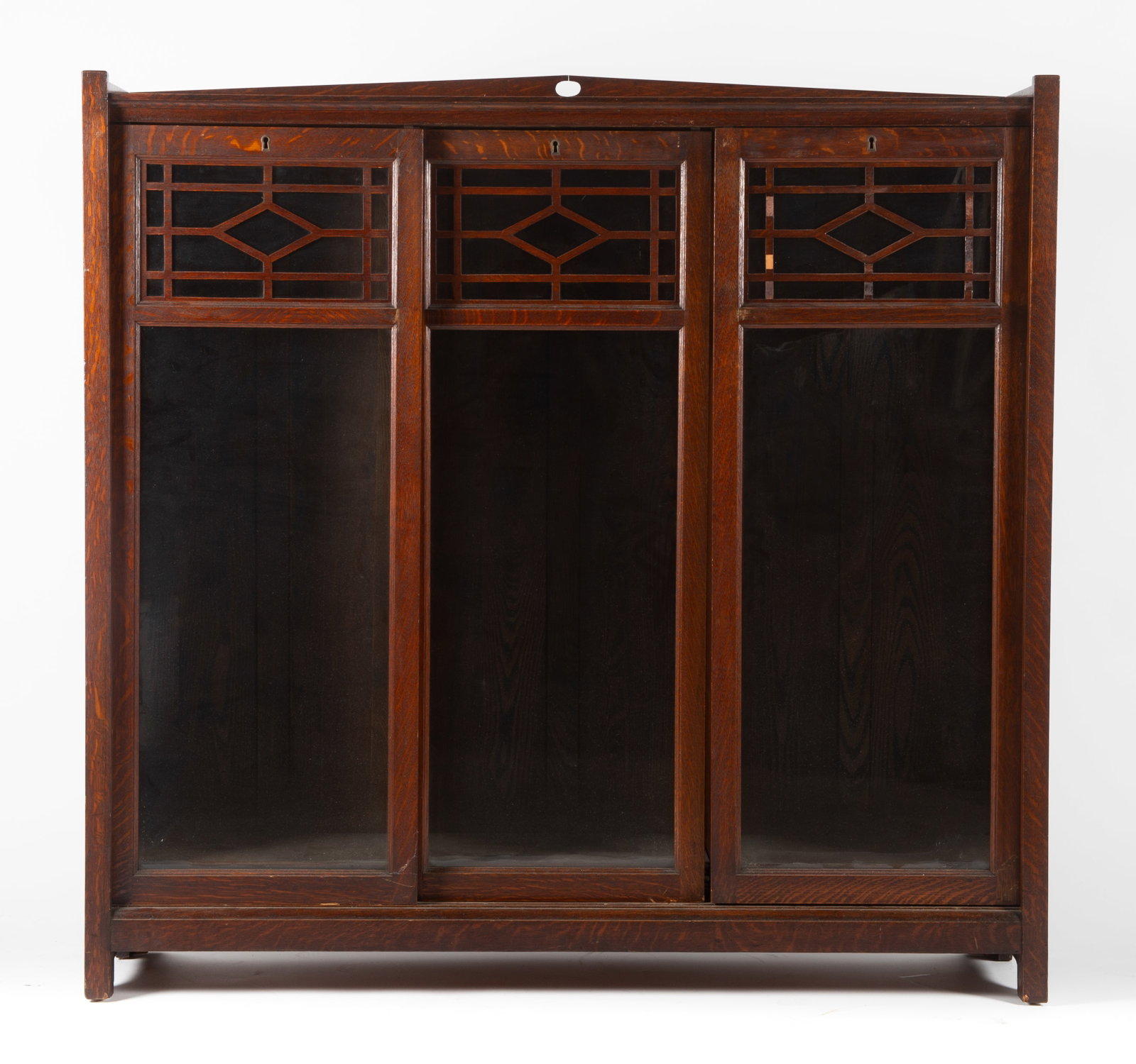 ARTS AND CRAFTS BOOKCASE: Oak - (3) sliding doors; original finish; H-50 1/2"xW-52"xD-13"; normal wear, G-VG