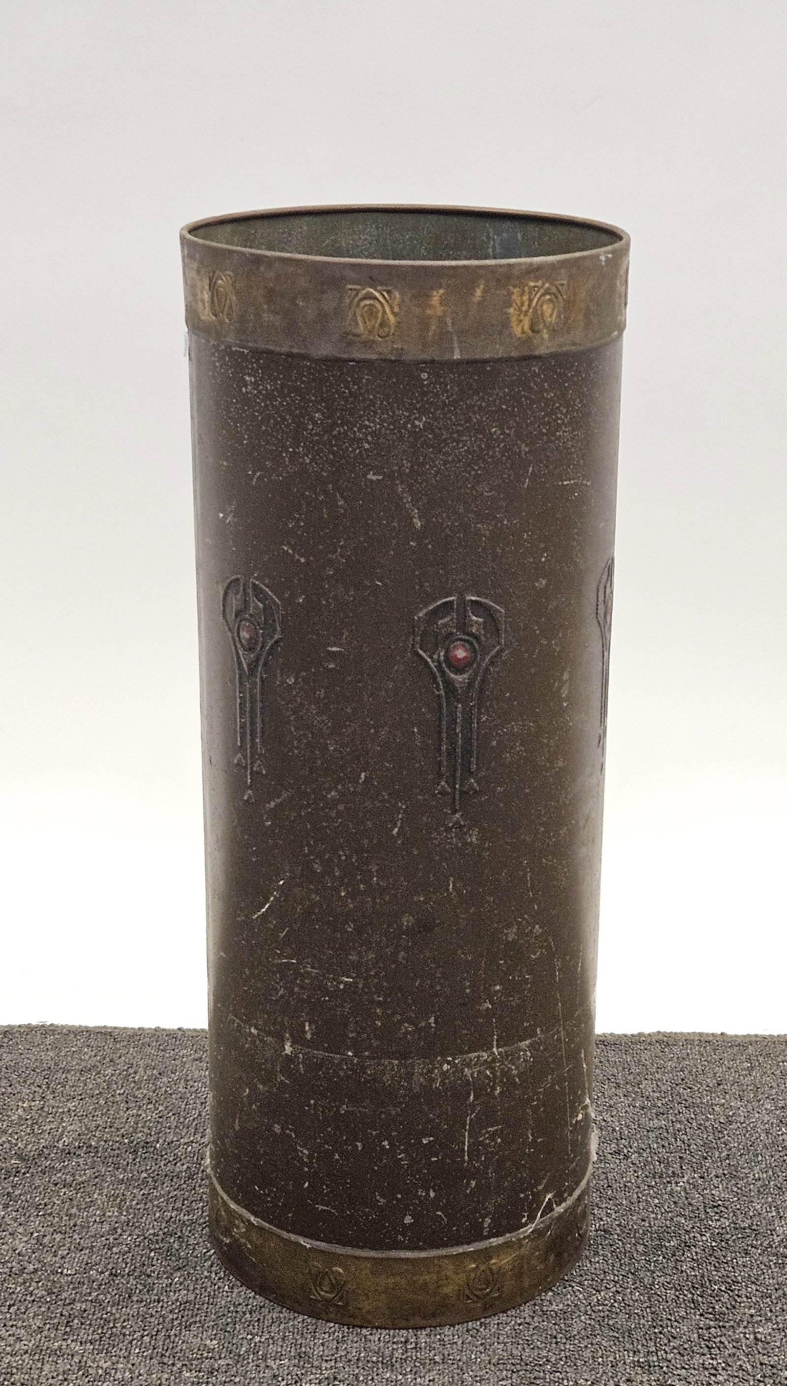 ART NOUVEAU UMBRELLA STAND: Embossed metal banding and central ring; H-24"xDia-9"; wear, F