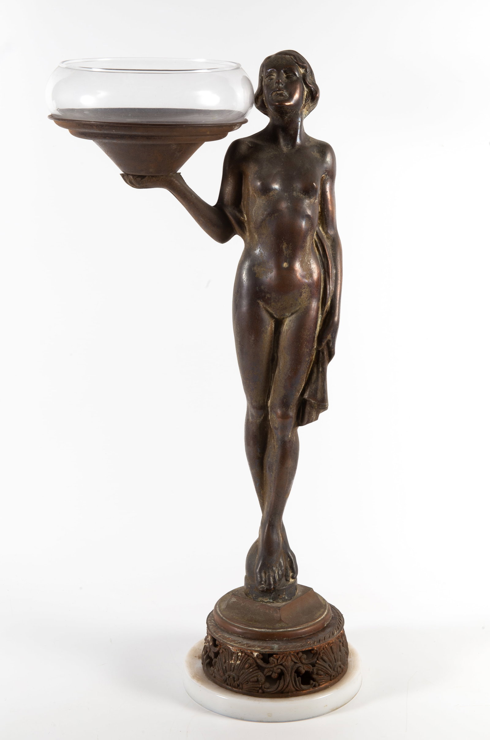 DECO FIGURAL STAND: Bronze patinated white metal nude holding clear glass bowl; milk glass base; H-27"; wear to patina; normal wear, components need tightening, G