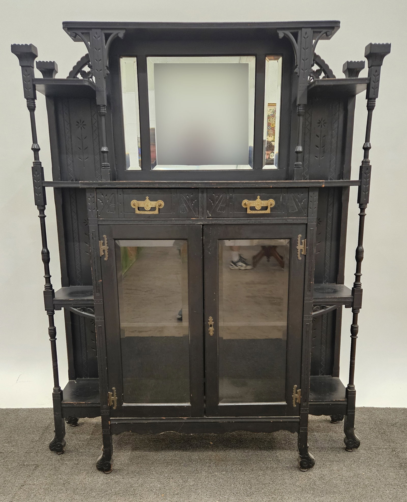 EASTLAKE CURIO CABINET: Ebonized finish; open top and sides; (3) beveled mirrors; bottom has (2) drawers over (2) beveled glass doors; H-60"xW-45"; normal wear, G-G+
