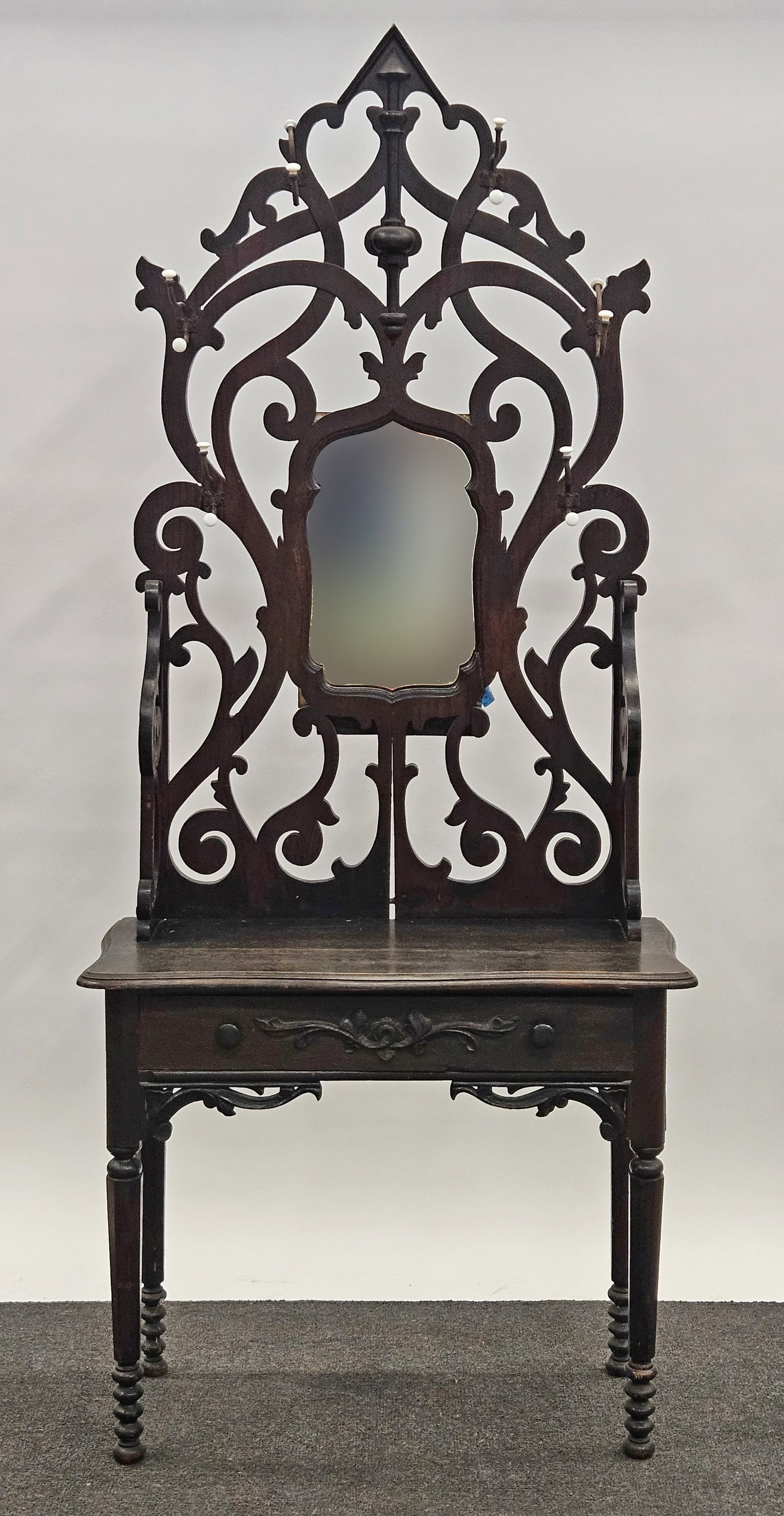 VCTORIAN HALL RACK: Stained oak and mixed wood; unusual form having an openwork top table top with drawer; open lower section; original finish; H-86"xW-36"; wear, F-G