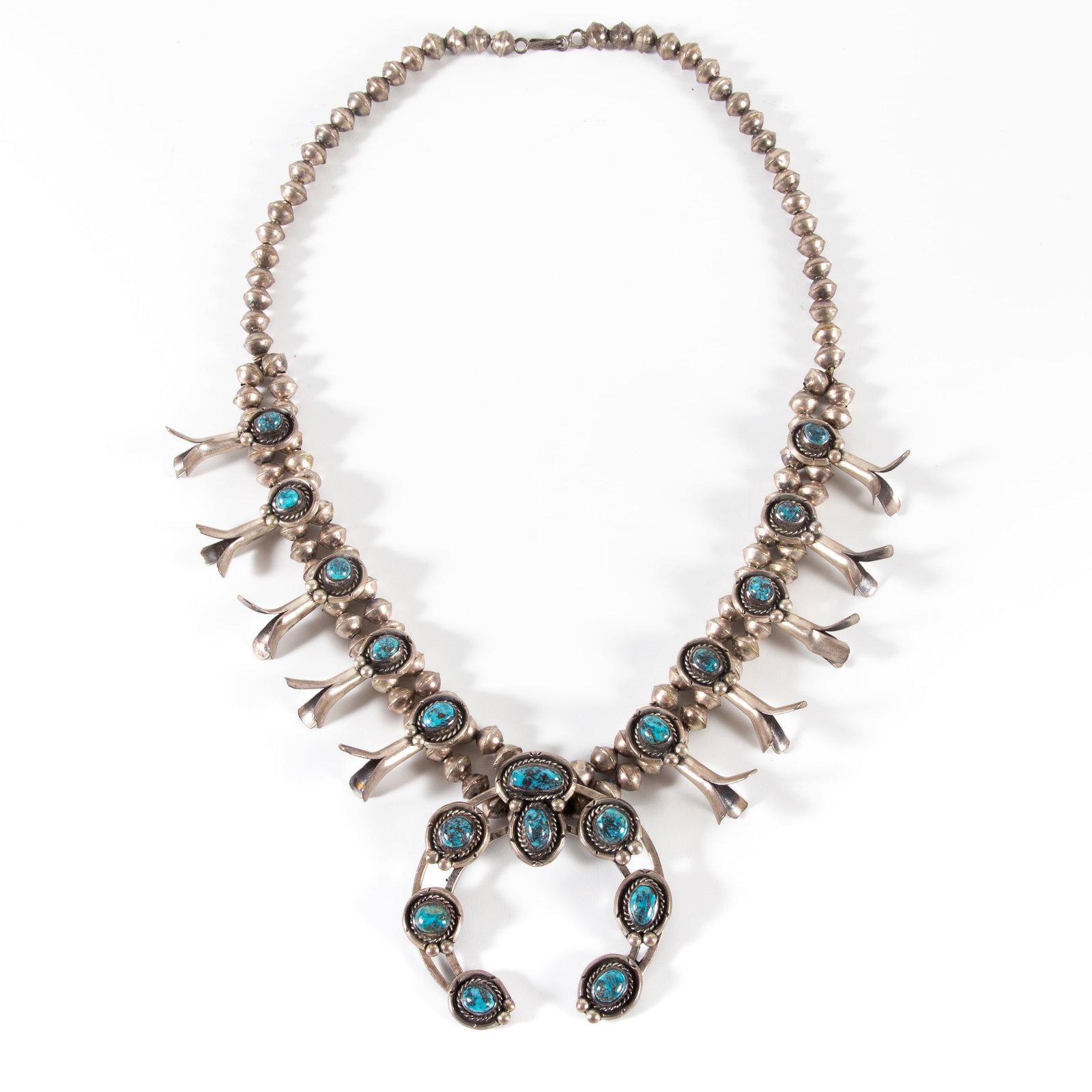 SOUTHWEST SQUASH BLOSSOM NECKLACE: Silver and turquoise; 23"; 3.99 T.O., VG-EX