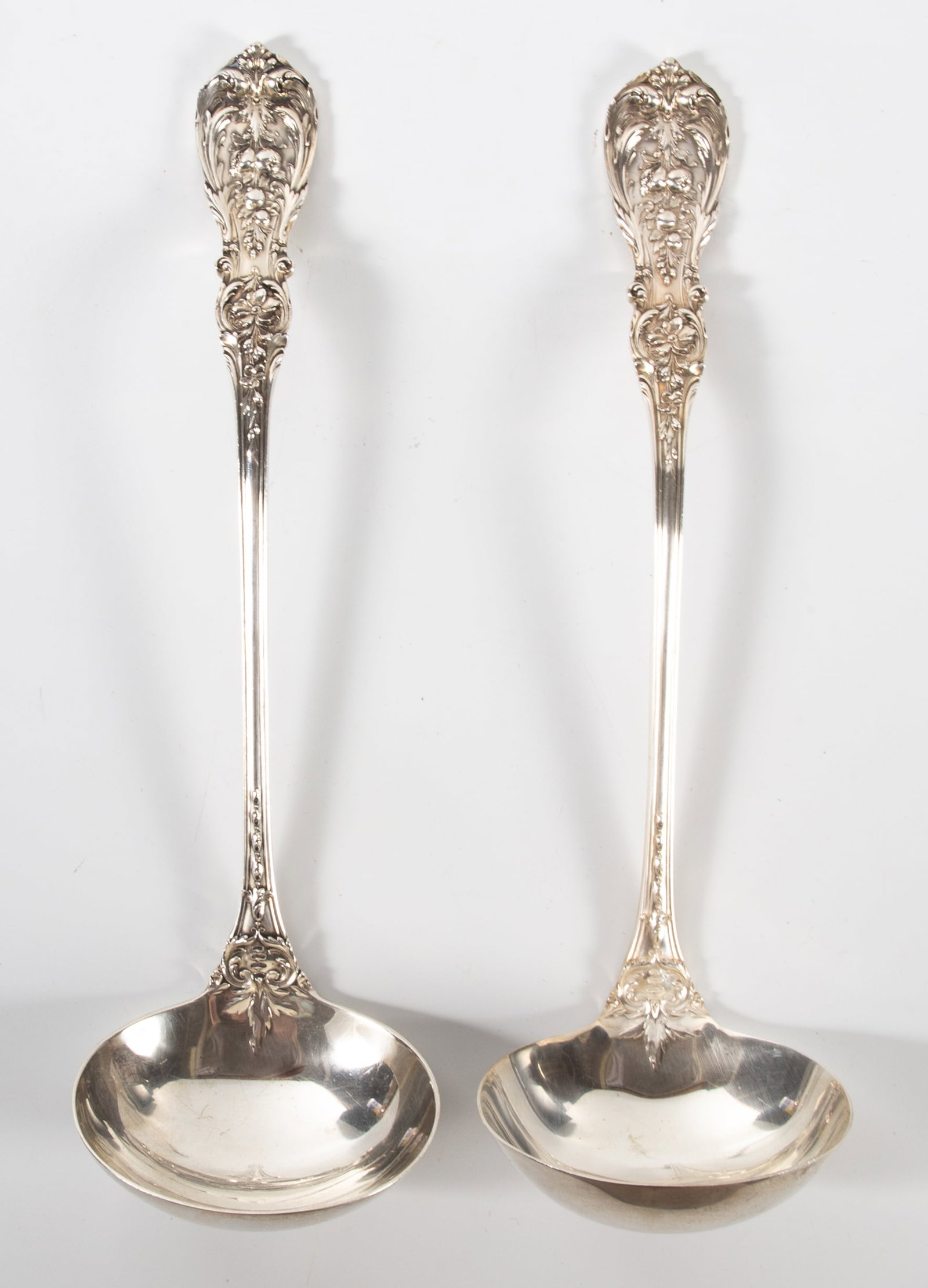 PAIR OF STERLING LADLES: Reed & Barton Francis I pattern, not monogrammed; 12 1/4"; 15.4 T.O. total for both; minimal wear, VG-EX