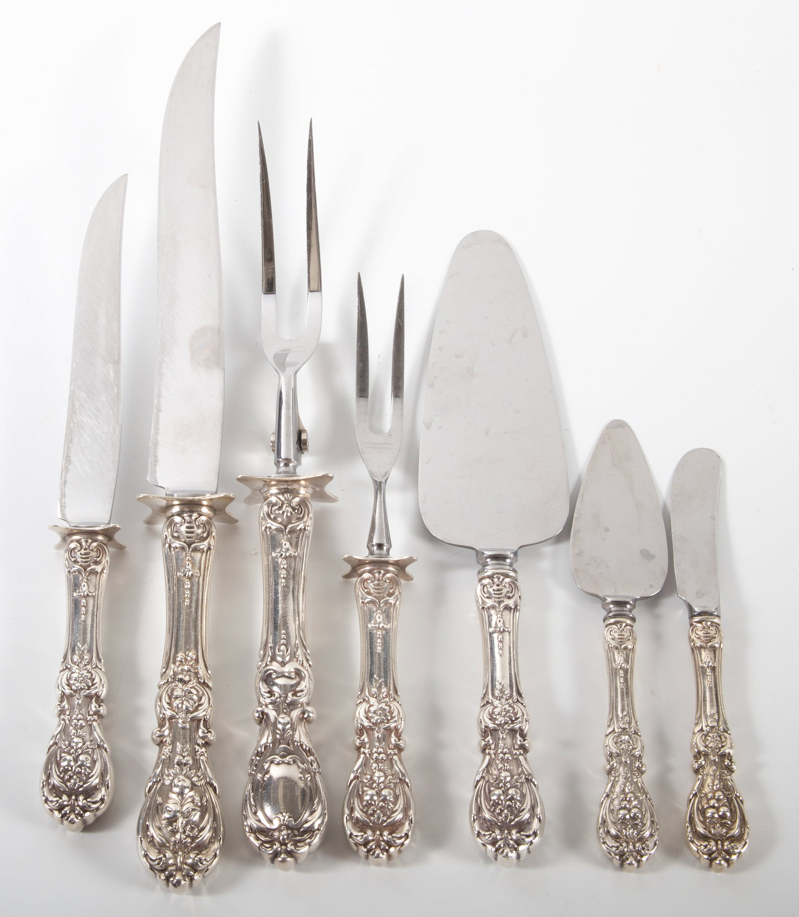 (7) STERLING HANDLED SERVERS: Reed & Barton Francis I pattern --- (2) piece carving set, 11 3/4"-13 3/4", (1) 6 1/4" spread, (2) piece carving set (monogrammed "W"), 9"-10 1/4", (1) 10" flat server (monogrammed "W"); (1) 6 5/8"