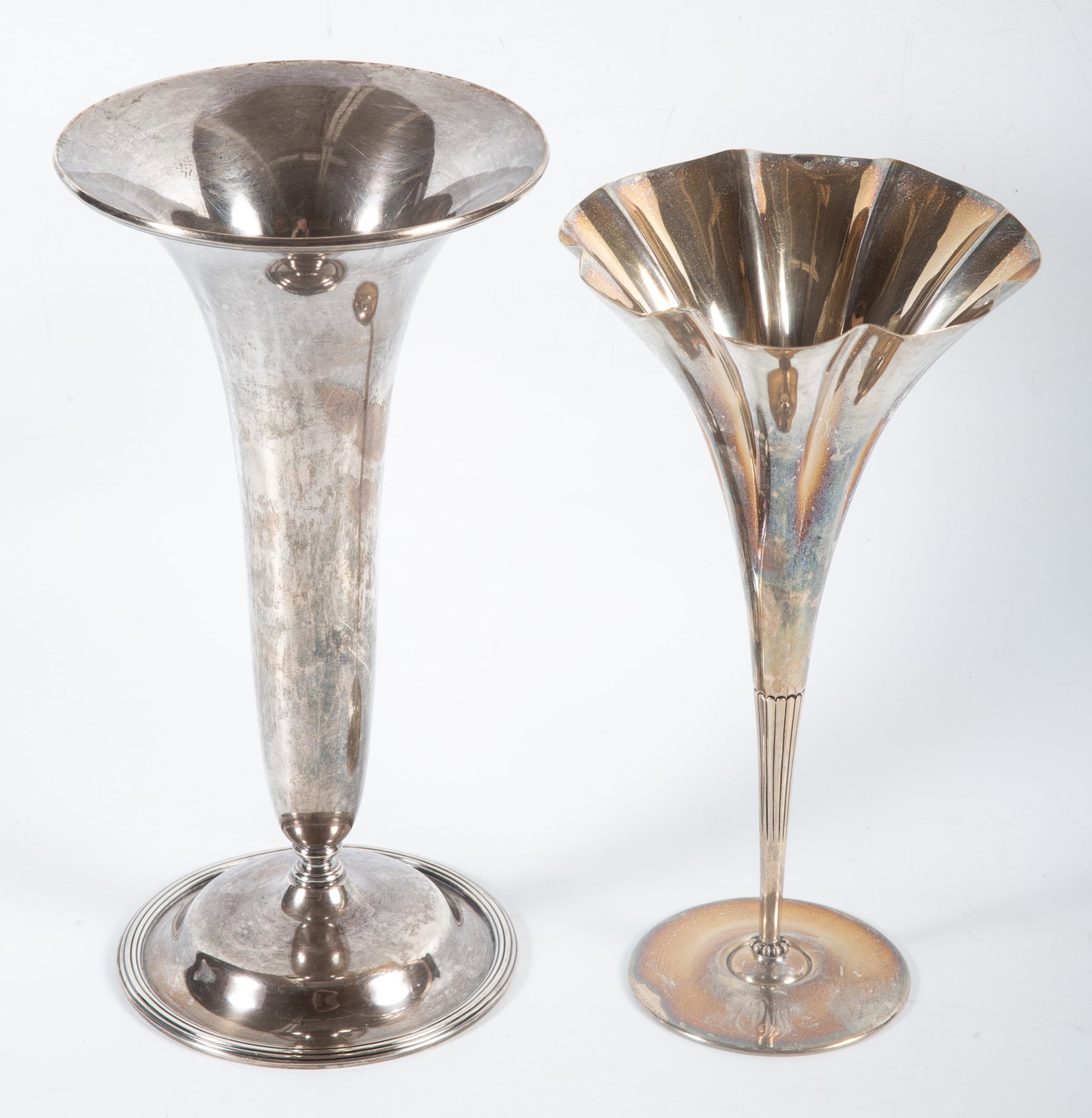 (2) STERLING VASES: (1) Tiffany - #11908-4254©; monogrammed A.W., H-9", 8.0 T.O.; (1) Kirk & Son - #350; plain; H-10"; 18.0 T.O.; [total +/-26.0 T.O.]; normal wear, VG