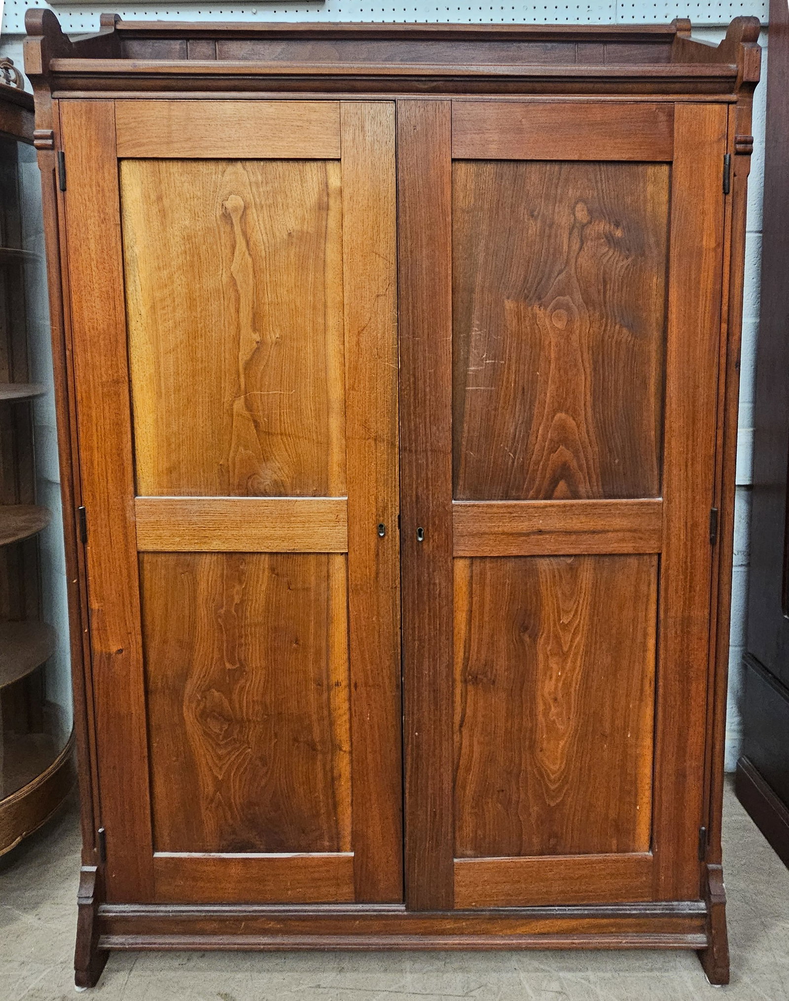 COUNTRY CUPBOARD: Walnut; (2) paneled doors; interior is fitted with fall down writing surface which can be easily removed; H-66"xW-45"; refinished; normal wear, G-VG