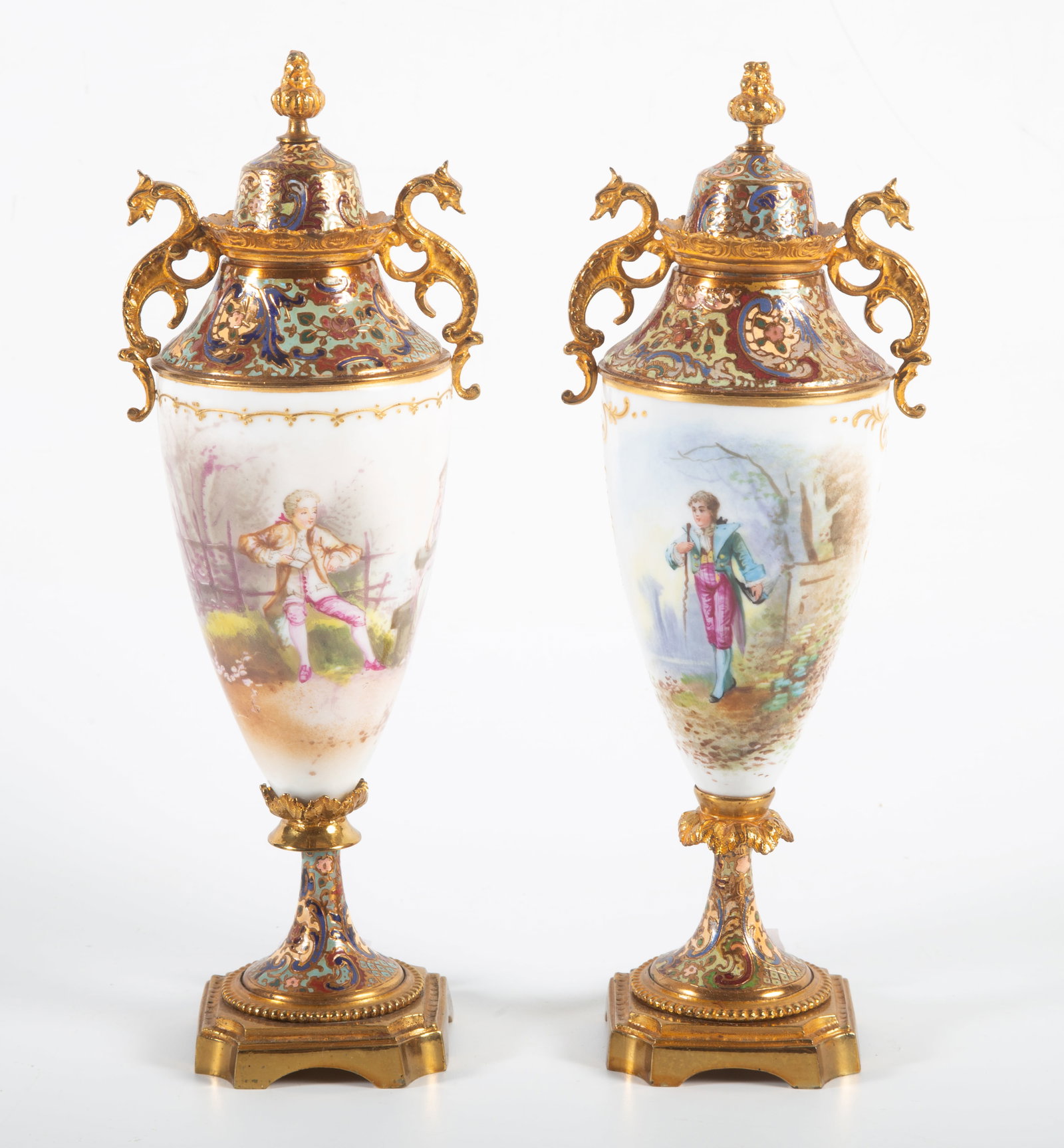 PAIR OF MINIATURE PORCELAIN URNS: Possibly Serves; painted porcelain bodies with courting scenes; enameled cloisonne tops, collars, and bases; H-10 1/2"; dragon handles; normal wear, VG
