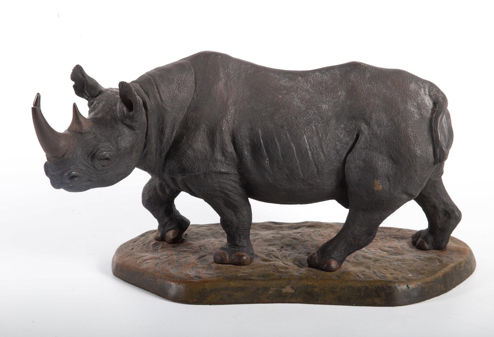 ROWLAND WARD RHINO SCULPTURE: Painted composition - 41/200; "Black Rhino Bull" - Jackie Noakes; L-15"; tip of horn cracked; normal wear, VG