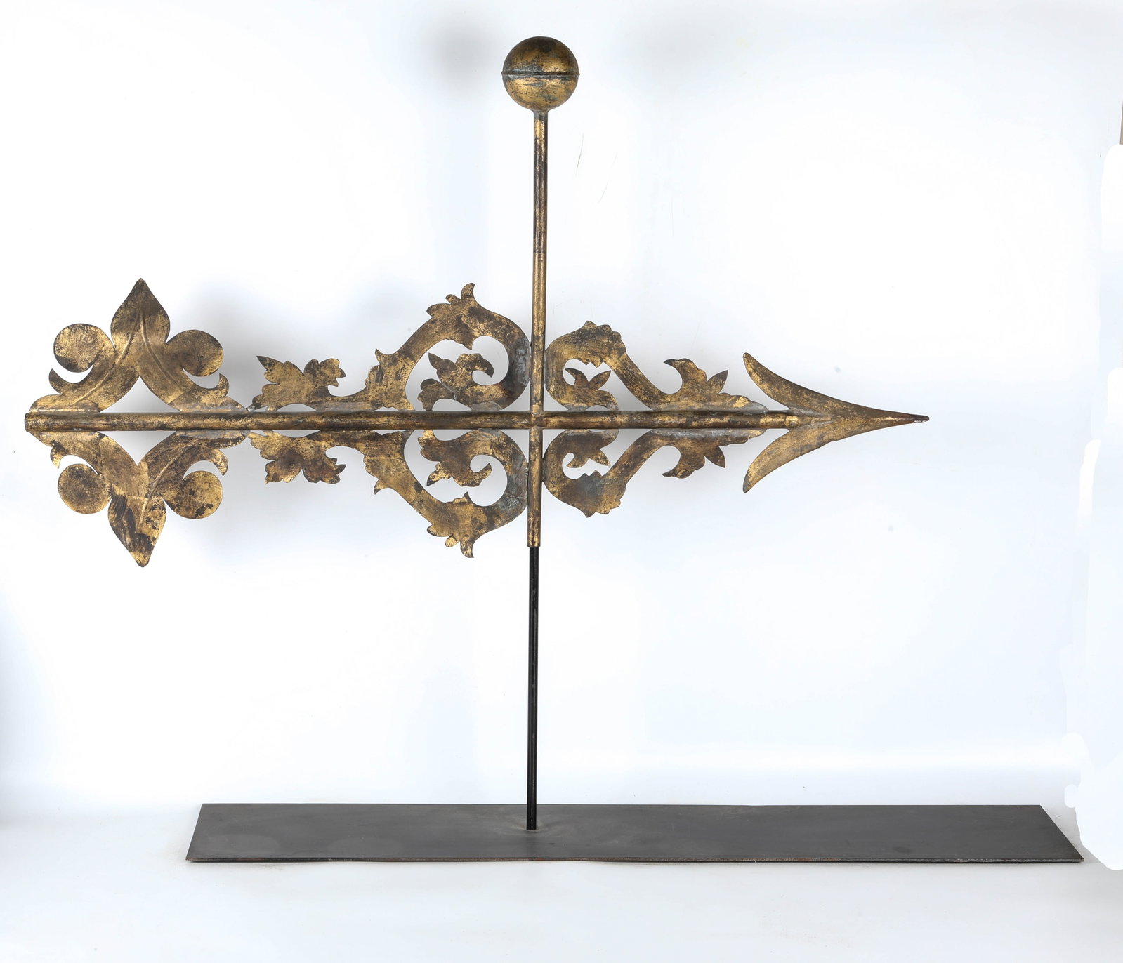 ANTIQUE ARROW WEATHERVANE: Gilt decorated; mounted on stand; H-33"xW-43"; normal wear, G