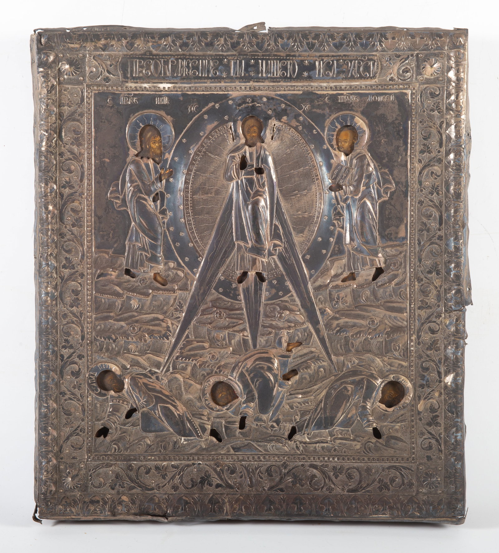 ANTIQUE ICON: Painted on wood; riza has several touch marks; 14"X12"; painted service is worn and has some losses; riza bent, some edge damage, F
