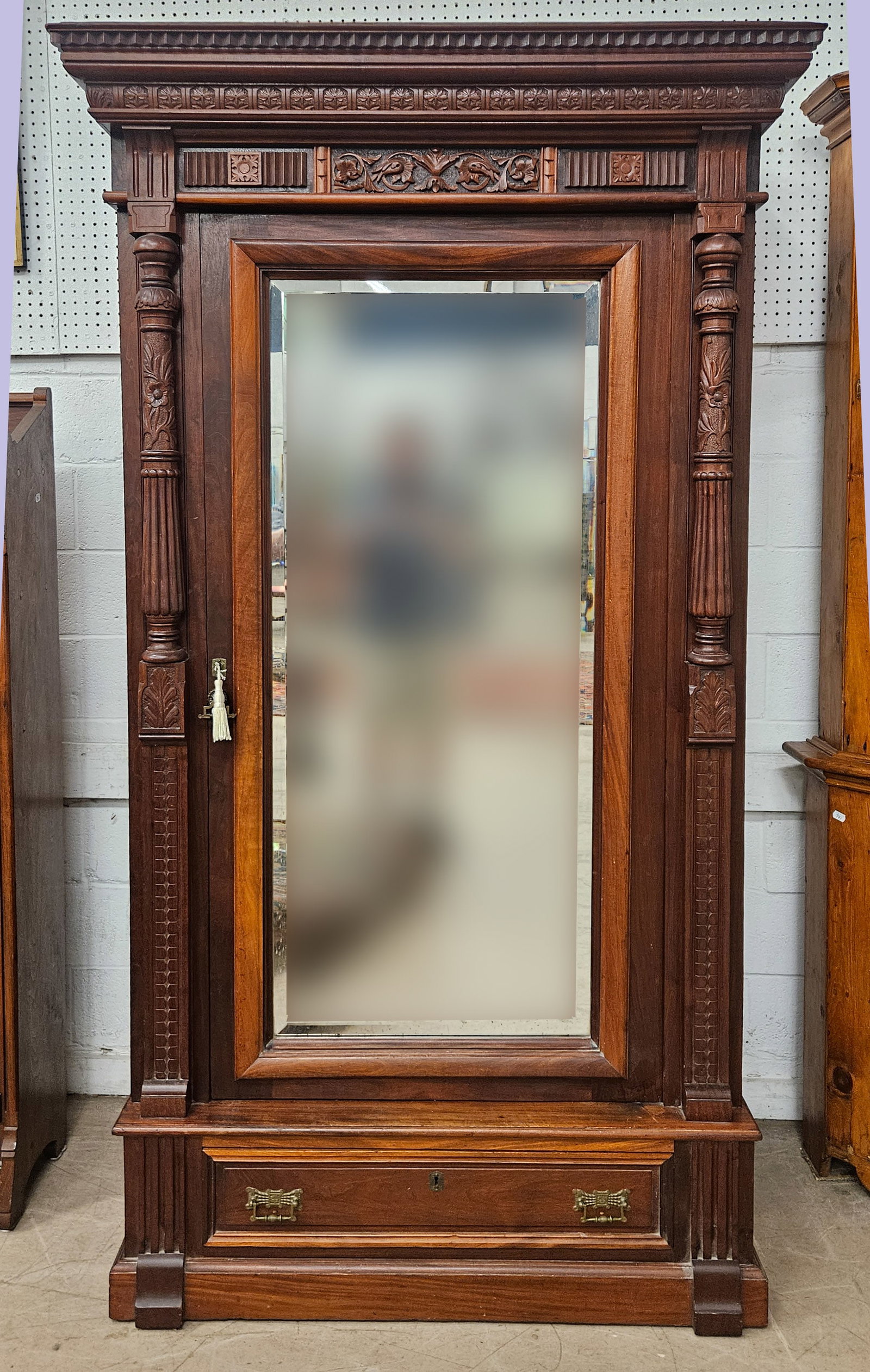 WALNUT VICTORIAN ARMOIRE: Single beveled mirror door, ornate carving, lower drawer, paneled ends, refinished, later fitted with shelves, H-88"xW-46", normal wear, VG